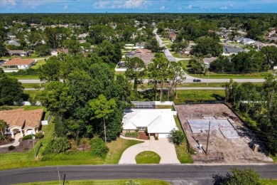 Discover the charm of 57 Woodhollow Dr, a stunning custom-built on The Grand Club - Pine Lakes Course in Florida - for sale on GolfHomes.com, golf home, golf lot