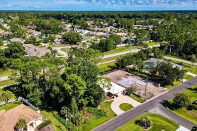 Discover the charm of 57 Woodhollow Dr, a stunning custom-built on The Grand Club - Pine Lakes Course in Florida - for sale on GolfHomes.com, golf home, golf lot