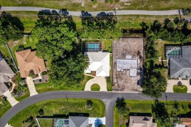 Discover the charm of 57 Woodhollow Dr, a stunning custom-built on The Grand Club - Pine Lakes Course in Florida - for sale on GolfHomes.com, golf home, golf lot