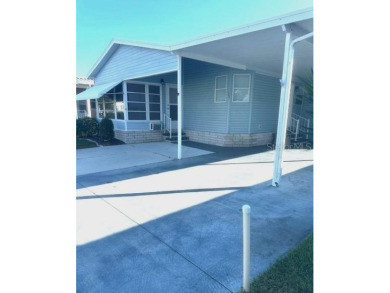 LOVELY WELL MAINTAINED 2 BEDROOM 2 BATH MANUFACTURED HOME on Lily Lake Golf and RV Resort in Florida - for sale on GolfHomes.com, golf home, golf lot