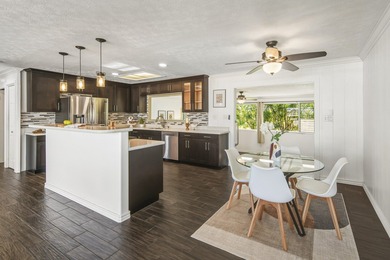 This charming home is located steps from the Hilo Municipal Golf on Hilo Municipal Golf Course in Hawaii - for sale on GolfHomes.com, golf home, golf lot