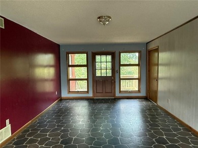 Close to the Country Club and golf course! This all-brick home on Holiday Island Golf Course in Arkansas - for sale on GolfHomes.com, golf home, golf lot