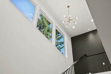 Modern design and Montana living come together in this 4-bedroom on Meadow Lake Golf Resort in Montana - for sale on GolfHomes.com, golf home, golf lot