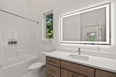 Modern design and Montana living come together in this 4-bedroom on Meadow Lake Golf Resort in Montana - for sale on GolfHomes.com, golf home, golf lot