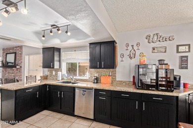 Updated 4-bedroom, 2.5-bathroom home with a 2.5-car garage on Arrowhead Country Club in Arizona - for sale on GolfHomes.com, golf home, golf lot