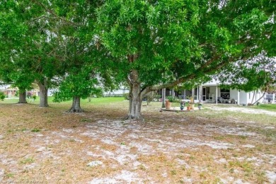 As you pull in the driveway you can see this well taken care of on Spring Lake Golf Resort in Florida - for sale on GolfHomes.com, golf home, golf lot