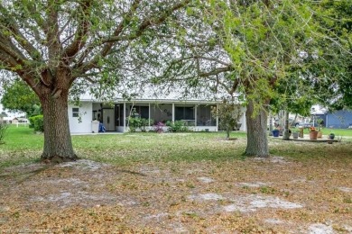 As you pull in the driveway you can see this well taken care of on Spring Lake Golf Resort in Florida - for sale on GolfHomes.com, golf home, golf lot