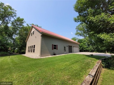 Tucked away in the woods on a spacious 1.8-acre lot, this modern on Whispering Pines Golf Club in Minnesota - for sale on GolfHomes.com, golf home, golf lot