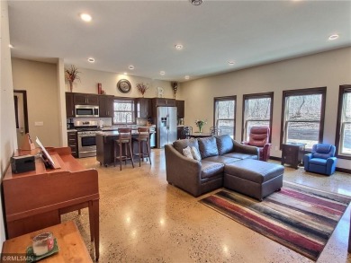 Tucked away in the woods on a spacious 1.8-acre lot, this modern on Whispering Pines Golf Club in Minnesota - for sale on GolfHomes.com, golf home, golf lot