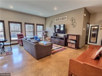 Tucked away in the woods on a spacious 1.8-acre lot, this modern on Whispering Pines Golf Club in Minnesota - for sale on GolfHomes.com, golf home, golf lot