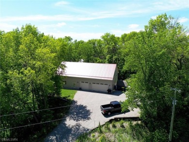 Tucked away in the woods on a spacious 1.8-acre lot, this modern on Whispering Pines Golf Club in Minnesota - for sale on GolfHomes.com, golf home, golf lot