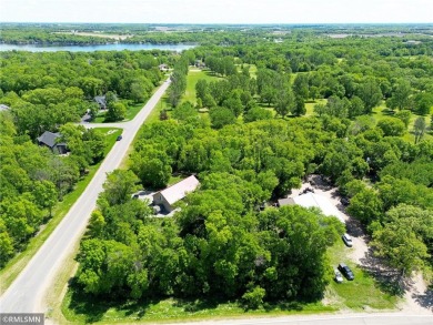 Tucked away in the woods on a spacious 1.8-acre lot, this modern on Whispering Pines Golf Club in Minnesota - for sale on GolfHomes.com, golf home, golf lot