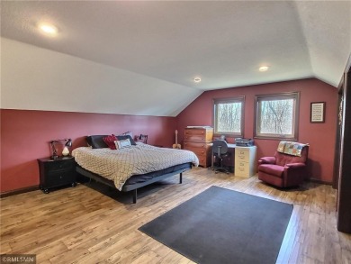 Tucked away in the woods on a spacious 1.8-acre lot, this modern on Whispering Pines Golf Club in Minnesota - for sale on GolfHomes.com, golf home, golf lot