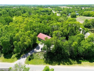 Tucked away in the woods on a spacious 1.8-acre lot, this modern on Whispering Pines Golf Club in Minnesota - for sale on GolfHomes.com, golf home, golf lot