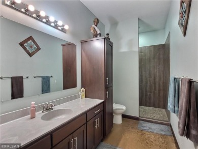 Tucked away in the woods on a spacious 1.8-acre lot, this modern on Whispering Pines Golf Club in Minnesota - for sale on GolfHomes.com, golf home, golf lot