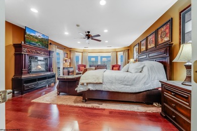 Sheathed in an exquisite brick exterior, this luxurious custom on Lakeview Golf Resort and Spa - Lakeview in West Virginia - for sale on GolfHomes.com, golf home, golf lot