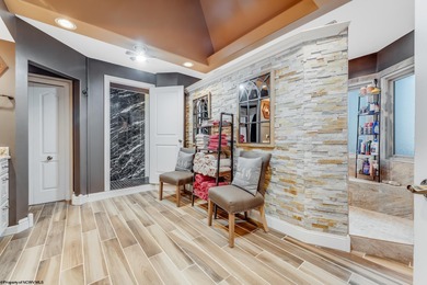 Sheathed in an exquisite brick exterior, this luxurious custom on Lakeview Golf Resort and Spa - Lakeview in West Virginia - for sale on GolfHomes.com, golf home, golf lot