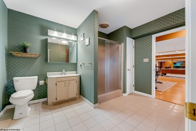 Sheathed in an exquisite brick exterior, this luxurious custom on Lakeview Golf Resort and Spa - Lakeview in West Virginia - for sale on GolfHomes.com, golf home, golf lot