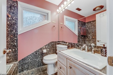 Sheathed in an exquisite brick exterior, this luxurious custom on Lakeview Golf Resort and Spa - Lakeview in West Virginia - for sale on GolfHomes.com, golf home, golf lot