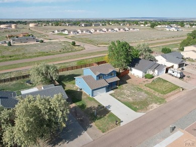 Welcome to 37 W Bonanza Drive, a stunning two-story home nestled on Desert Hawk At Pueblo West in Colorado - for sale on GolfHomes.com, golf home, golf lot