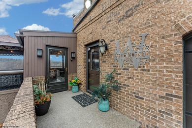 Sheathed in an exquisite brick exterior, this luxurious custom on Lakeview Golf Resort and Spa - Lakeview in West Virginia - for sale on GolfHomes.com, golf home, golf lot