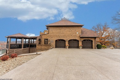 Sheathed in an exquisite brick exterior, this luxurious custom on Lakeview Golf Resort and Spa - Lakeview in West Virginia - for sale on GolfHomes.com, golf home, golf lot