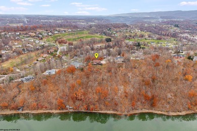 Sheathed in an exquisite brick exterior, this luxurious custom on Lakeview Golf Resort and Spa - Lakeview in West Virginia - for sale on GolfHomes.com, golf home, golf lot