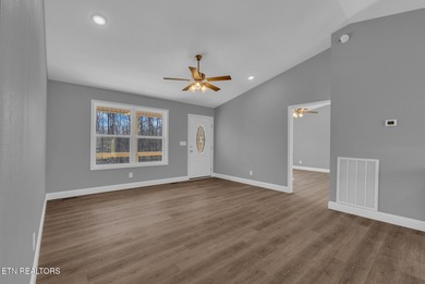 Experience the perfect blend of modern comfort and lakeside on Lake Tansi Village Country Club in Tennessee - for sale on GolfHomes.com, golf home, golf lot