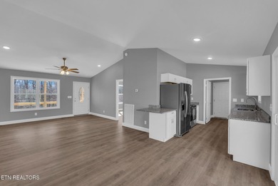 Experience the perfect blend of modern comfort and lakeside on Lake Tansi Village Country Club in Tennessee - for sale on GolfHomes.com, golf home, golf lot