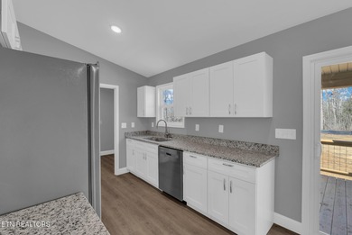 Experience the perfect blend of modern comfort and lakeside on Lake Tansi Village Country Club in Tennessee - for sale on GolfHomes.com, golf home, golf lot