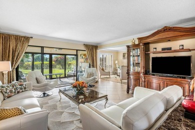 Enjoy picturesque views of the lush golf course and serene on Quail Ridge Golf Course and Country Club in Florida - for sale on GolfHomes.com, golf home, golf lot