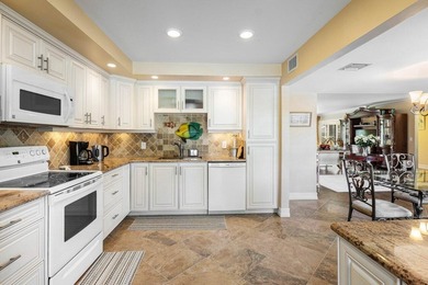 Enjoy picturesque views of the lush golf course and serene on Quail Ridge Golf Course and Country Club in Florida - for sale on GolfHomes.com, golf home, golf lot