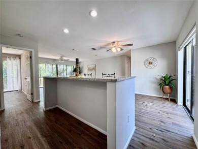 WELCOME to this bright and spacious villa located in the HIGHLY on East Lake Woodlands Country Club in Florida - for sale on GolfHomes.com, golf home, golf lot