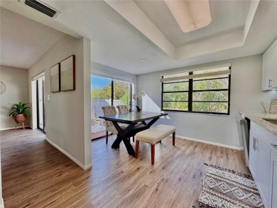 WELCOME to this bright and spacious villa located in the HIGHLY on East Lake Woodlands Country Club in Florida - for sale on GolfHomes.com, golf home, golf lot