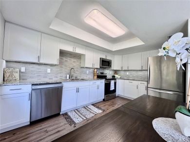 WELCOME to this bright and spacious villa located in the HIGHLY on East Lake Woodlands Country Club in Florida - for sale on GolfHomes.com, golf home, golf lot