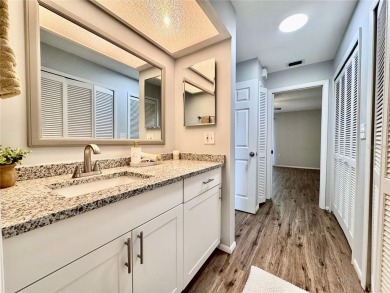 WELCOME to this bright and spacious villa located in the HIGHLY on East Lake Woodlands Country Club in Florida - for sale on GolfHomes.com, golf home, golf lot