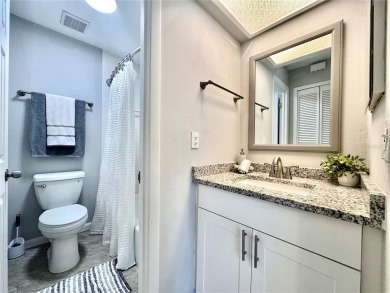 WELCOME to this bright and spacious villa located in the HIGHLY on East Lake Woodlands Country Club in Florida - for sale on GolfHomes.com, golf home, golf lot