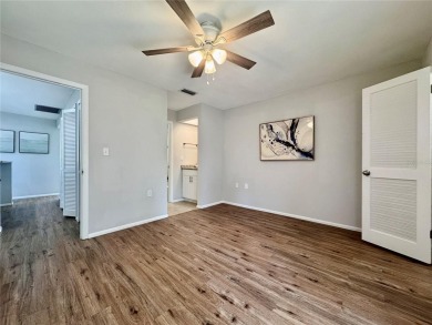 WELCOME to this bright and spacious villa located in the HIGHLY on East Lake Woodlands Country Club in Florida - for sale on GolfHomes.com, golf home, golf lot