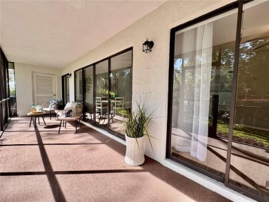 WELCOME to this bright and spacious villa located in the HIGHLY on East Lake Woodlands Country Club in Florida - for sale on GolfHomes.com, golf home, golf lot