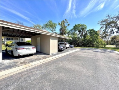 WELCOME to this bright and spacious villa located in the HIGHLY on East Lake Woodlands Country Club in Florida - for sale on GolfHomes.com, golf home, golf lot