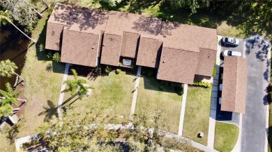 WELCOME to this bright and spacious villa located in the HIGHLY on East Lake Woodlands Country Club in Florida - for sale on GolfHomes.com, golf home, golf lot