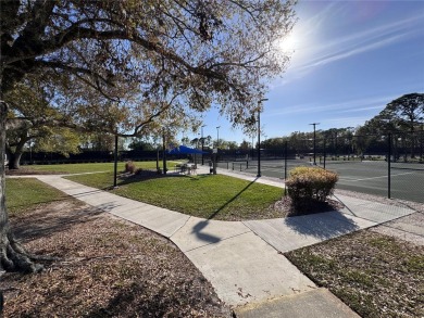 WELCOME to this bright and spacious villa located in the HIGHLY on East Lake Woodlands Country Club in Florida - for sale on GolfHomes.com, golf home, golf lot