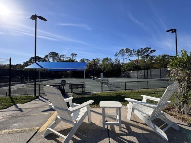 WELCOME to this bright and spacious villa located in the HIGHLY on East Lake Woodlands Country Club in Florida - for sale on GolfHomes.com, golf home, golf lot