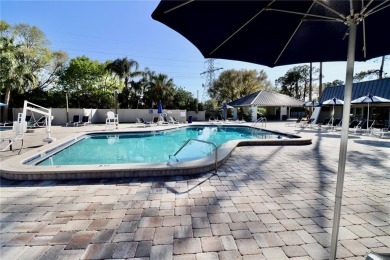 WELCOME to this bright and spacious villa located in the HIGHLY on East Lake Woodlands Country Club in Florida - for sale on GolfHomes.com, golf home, golf lot