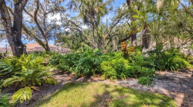 Serene, easy-living villa with treed views in the prestigious on The Meadows Golf and Country Club in Florida - for sale on GolfHomes.com, golf home, golf lot