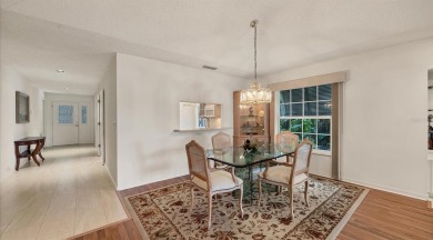 Serene, easy-living villa with treed views in the prestigious on The Meadows Golf and Country Club in Florida - for sale on GolfHomes.com, golf home, golf lot