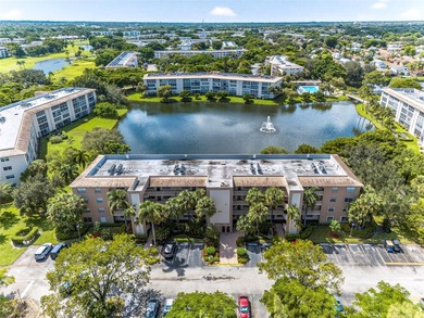 First-floor, fully renovated lakefront residence designed for on Wynmoor Golf Course in Florida - for sale on GolfHomes.com, golf home, golf lot