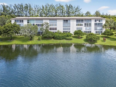 First-floor, fully renovated lakefront residence designed for on Wynmoor Golf Course in Florida - for sale on GolfHomes.com, golf home, golf lot