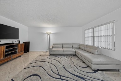 FIRST FLOOR -- COMPLETELY RENOVATED LAKEFRONT HOME that will on Wynmoor Golf Course in Florida - for sale on GolfHomes.com, golf home, golf lot