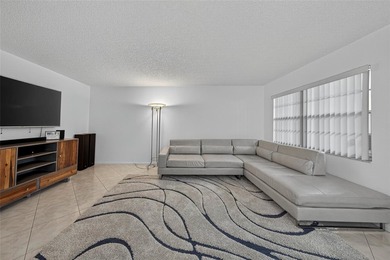 First-floor, fully renovated lakefront residence designed for on Wynmoor Golf Course in Florida - for sale on GolfHomes.com, golf home, golf lot